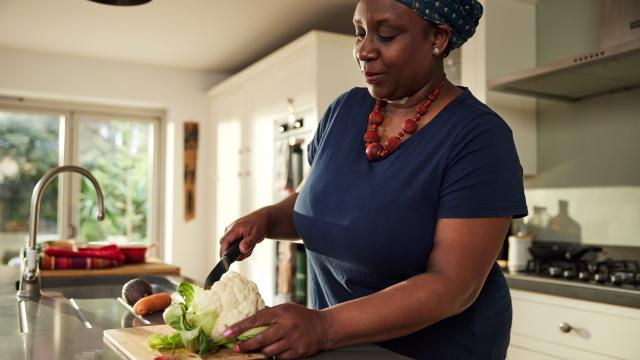 lady chopping vegetables up