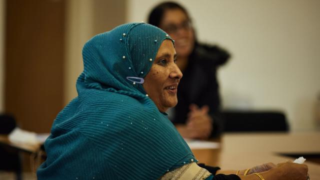 Woman sitting in meeting