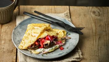 Veggie wraps on plate with knife and fork