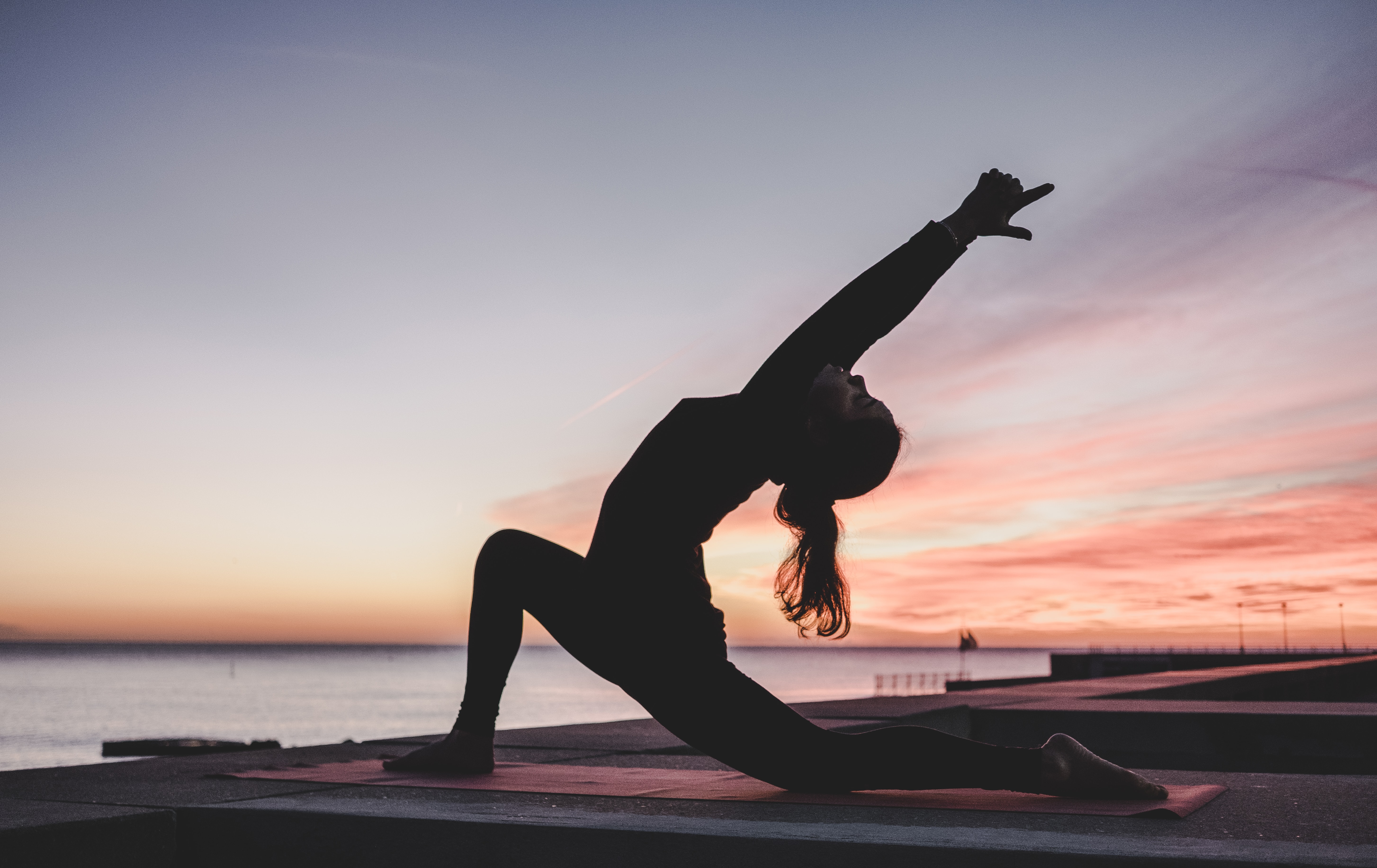 Woman practicing yoga in an open space