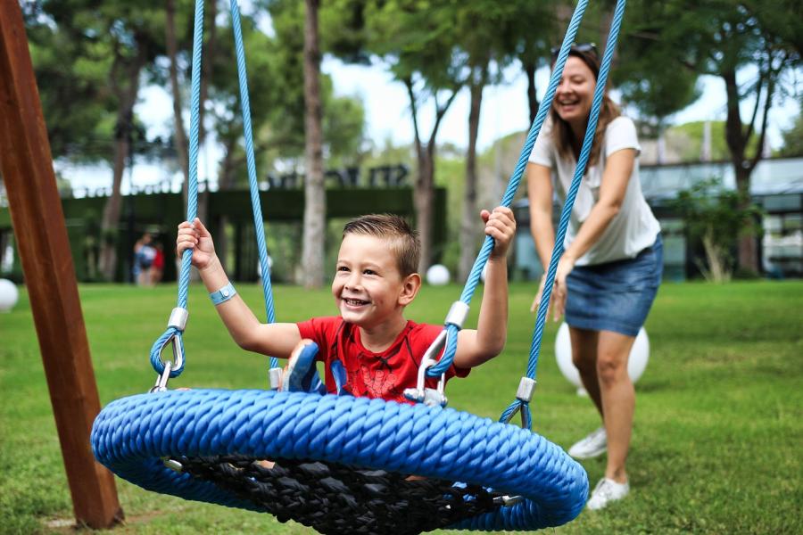 Mother playing with child in playground