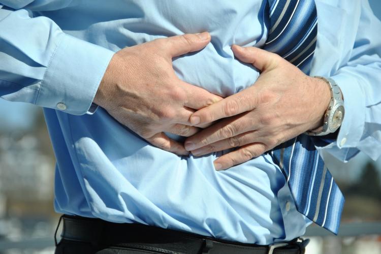 Man suffering from gastric pain