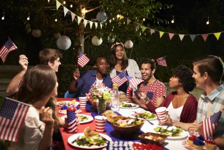 Diverse group of friends celebrate Independence Day in backyard party